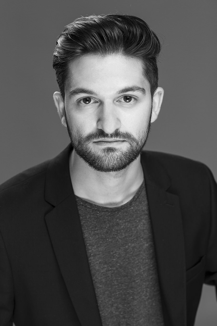 Black & white commercial headshot of male taken in Cardiff Bay studio