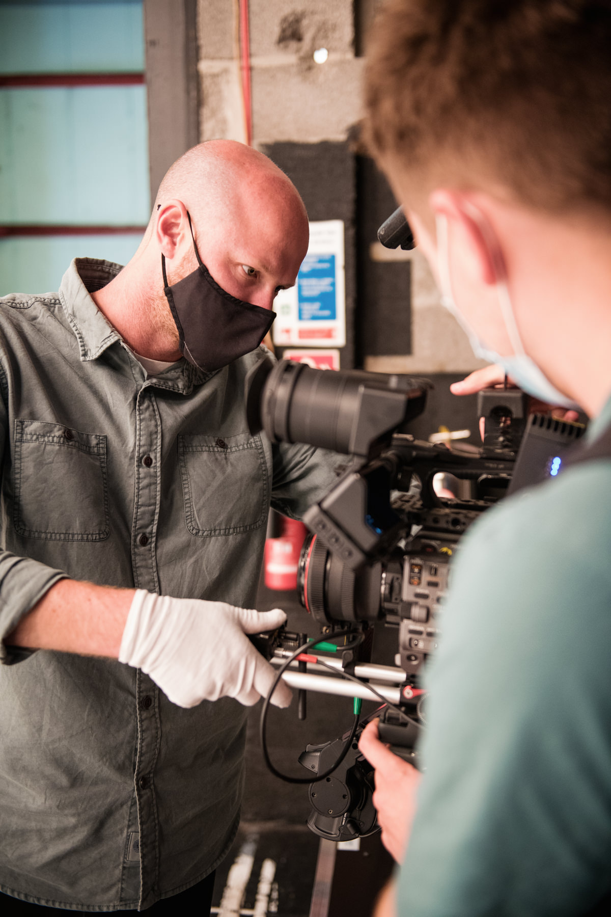 Behind the scene of crew adjusting the camera